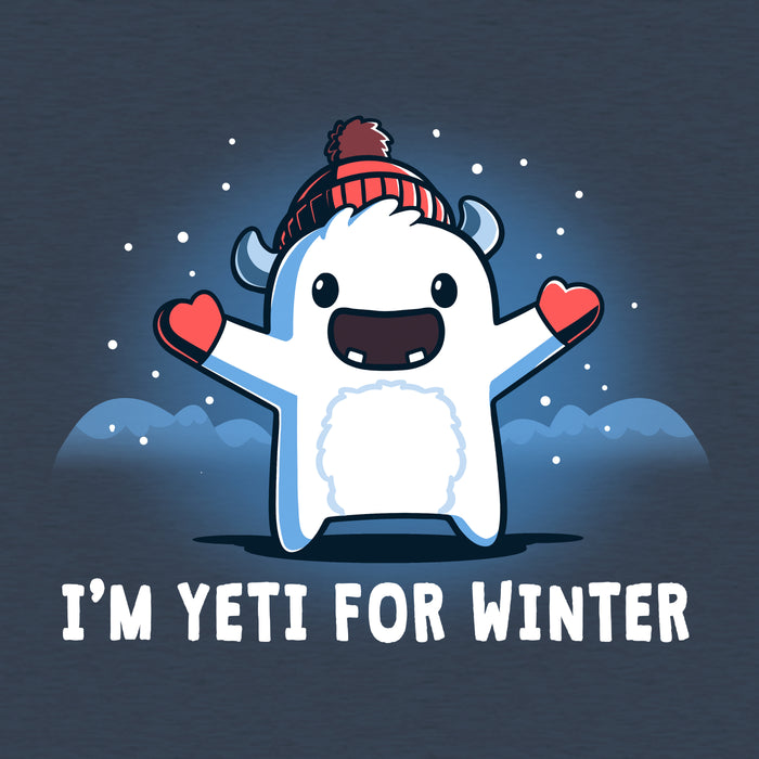 Classic Cotton T-shirt_Teeturtle heather navy I'm Yeti for Winter apparel featuring a happy Yeti in the snowy winter mountains wearing a pom-pom winter hat and mittens. Caption reads "I'm yeti for winter".