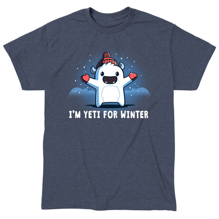 Classic Cotton T-shirt_Teeturtle heather navy I'm Yeti for Winter apparel featuring a happy Yeti in the snowy winter mountains wearing a pom-pom winter hat and mittens. Caption reads "I'm yeti for winter".