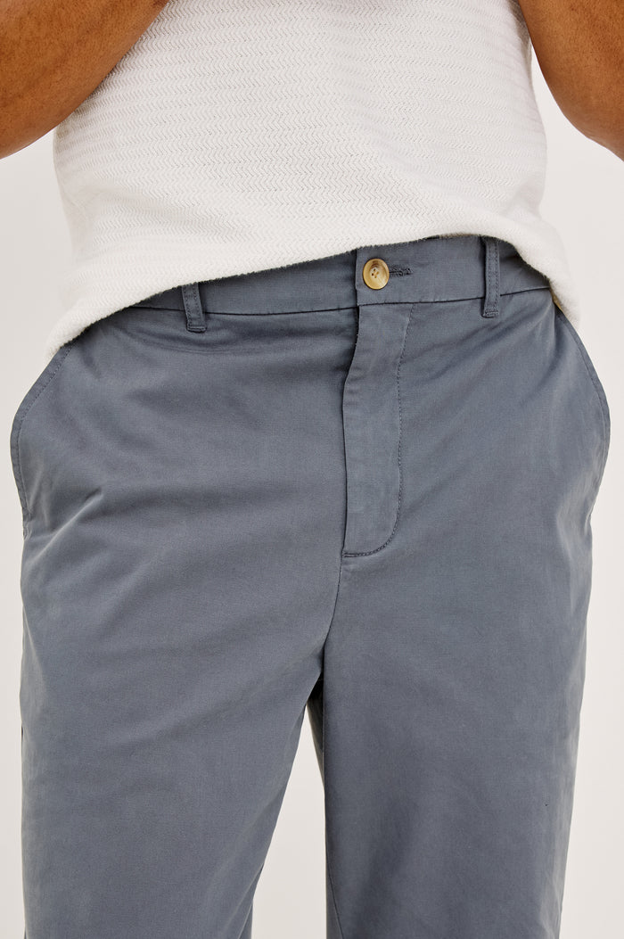 Irving Slim Straight Pant With Side Slant Pockets and Back Welt Pockets in Ensign Blue Colorway - Full Body Front View Featured on Model