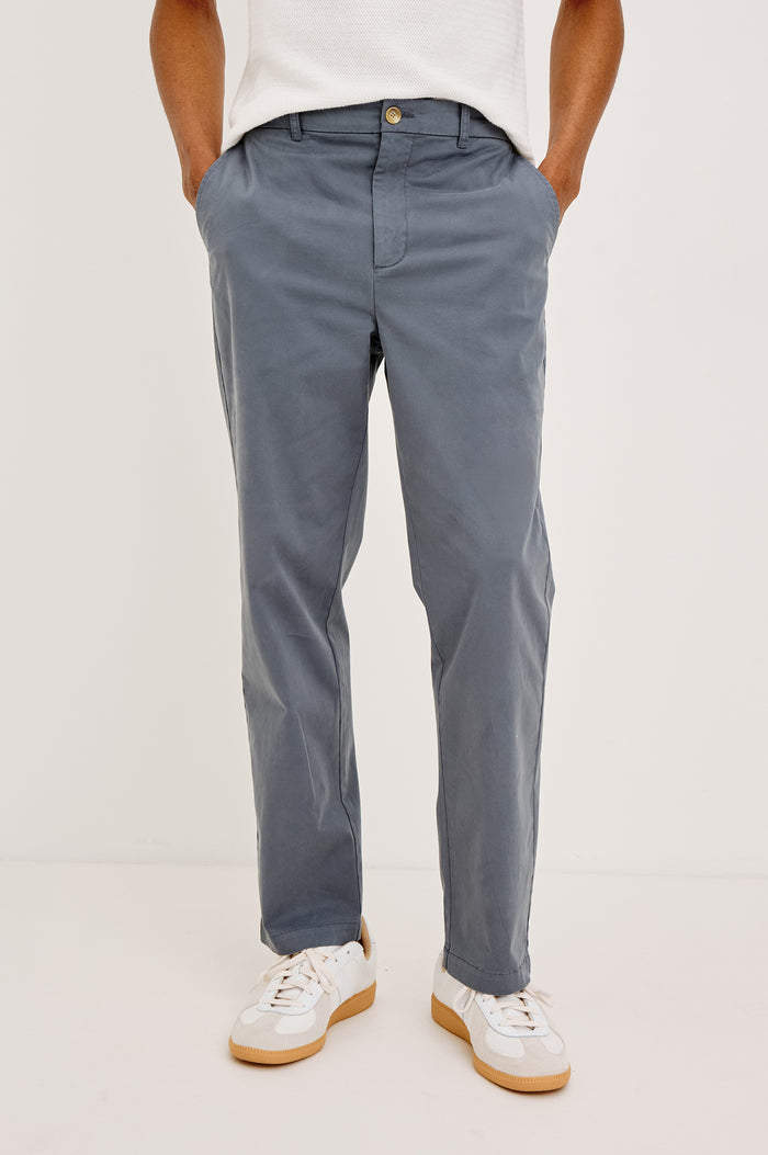 Irving Slim Straight Pant With Side Slant Pockets and Back Welt Pockets in Ensign Blue Colorway - Lower Body Front View Featured on Model