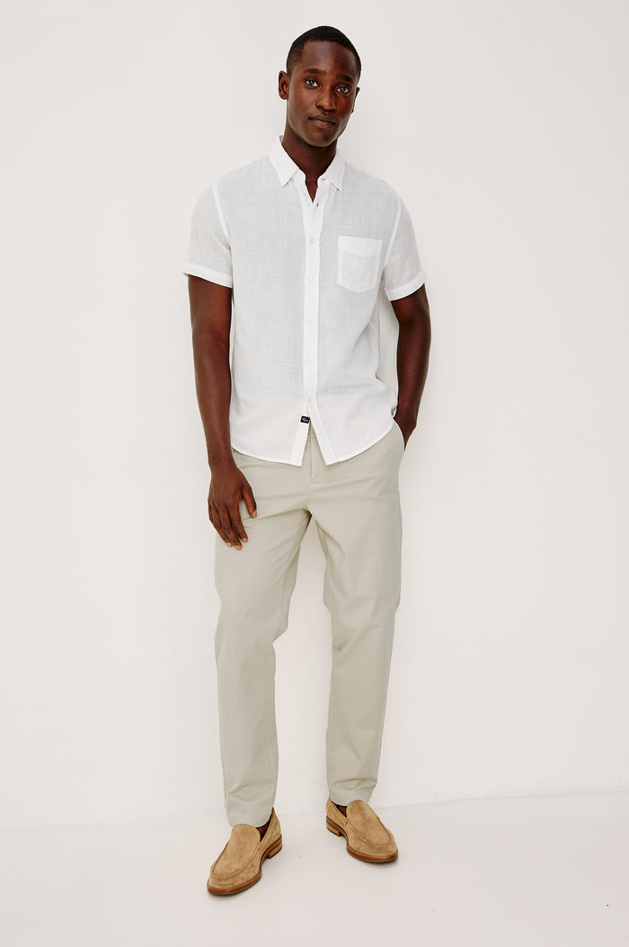 Irving Slim Straight Pant With Side Slant Pockets, and Back Welt Pockets in Stone Colorway - Full Body Back View Featured on Model