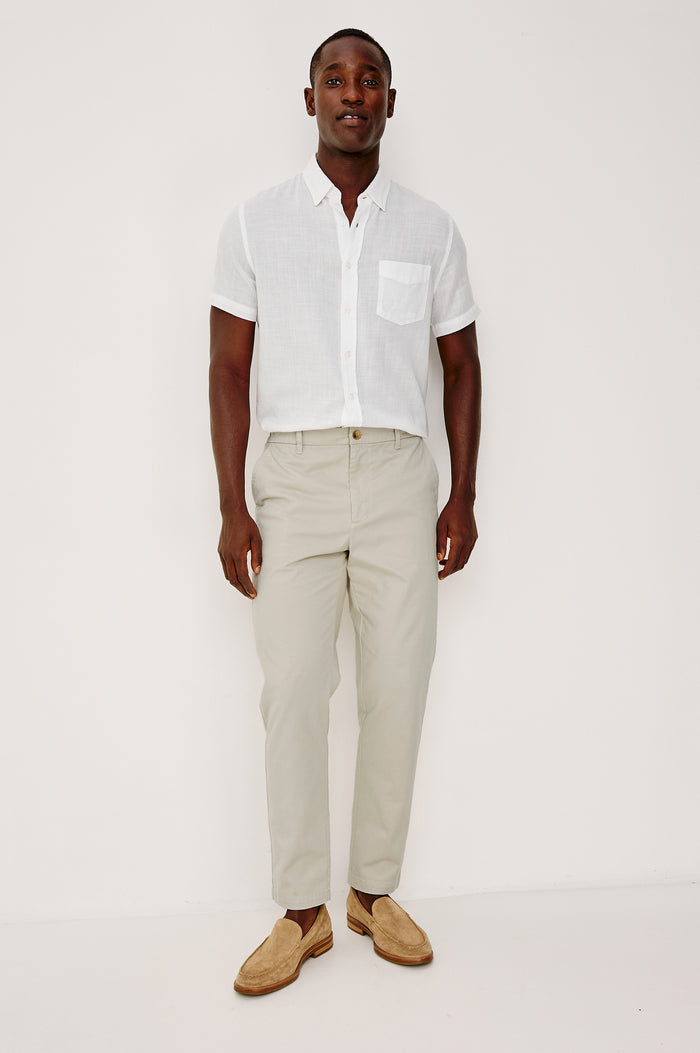 Irving Slim Straight Pant With Side Slant Pockets, and Back Welt Pockets in Stone Colorway - Full Body Front View Featured on Model