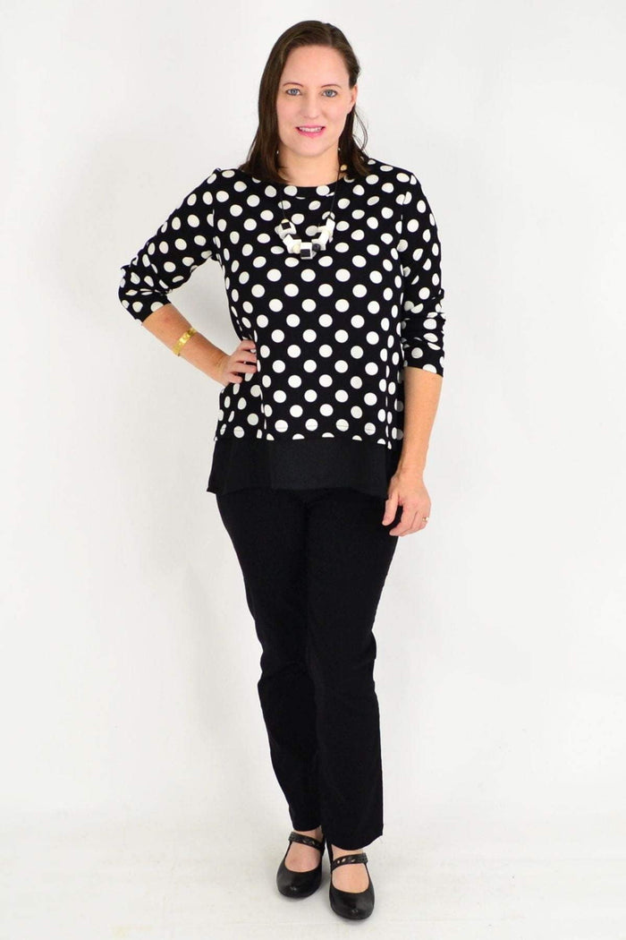 Black Jillian Spot Tunic Top by Stylius with white polka dots, long sleeves, and a relaxed fit.
