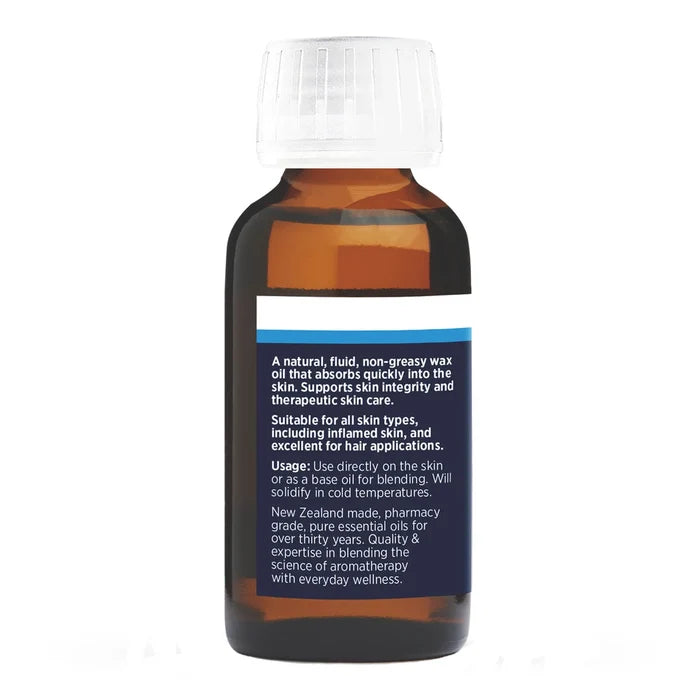Bottle of New Zealand made pharmacy grade jojoba oil with text on a white background.
