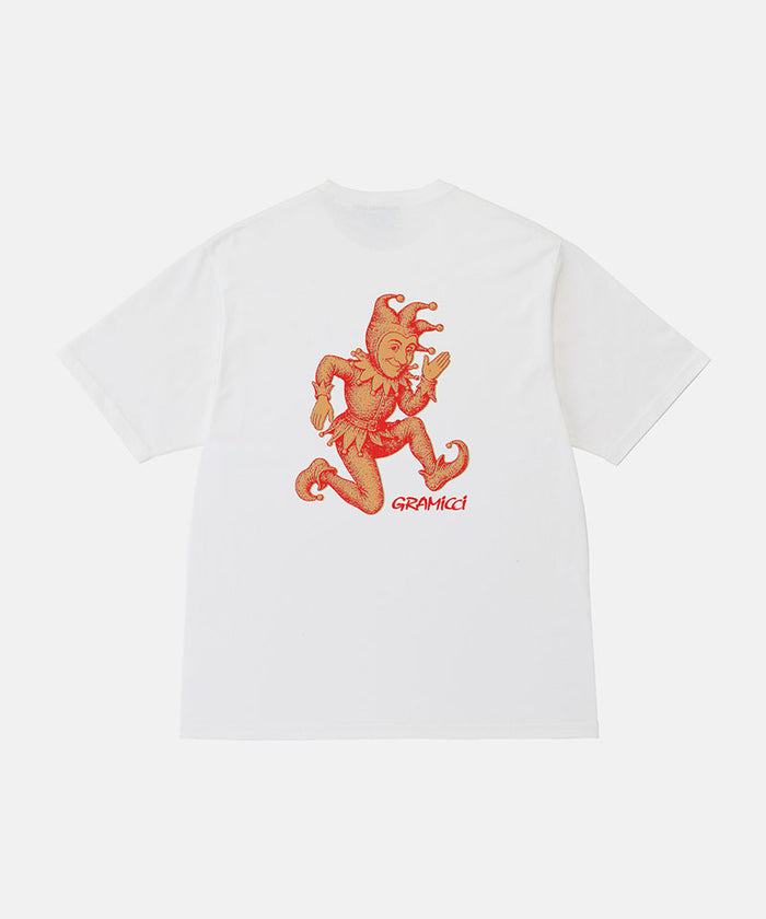 Back view of a Gramicci white Joker Tee with an orange graphic against a light-tone background.