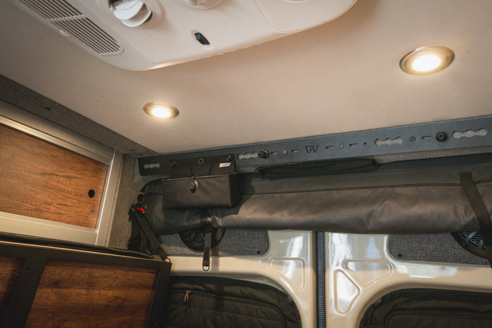 L-Track Pro installed above rear doors in Storyteller Overland Mode van interior ceiling.