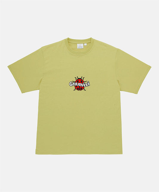 Gramicci sweet pea colored Ladybug Tee with colorful graphic against a light-tone background.