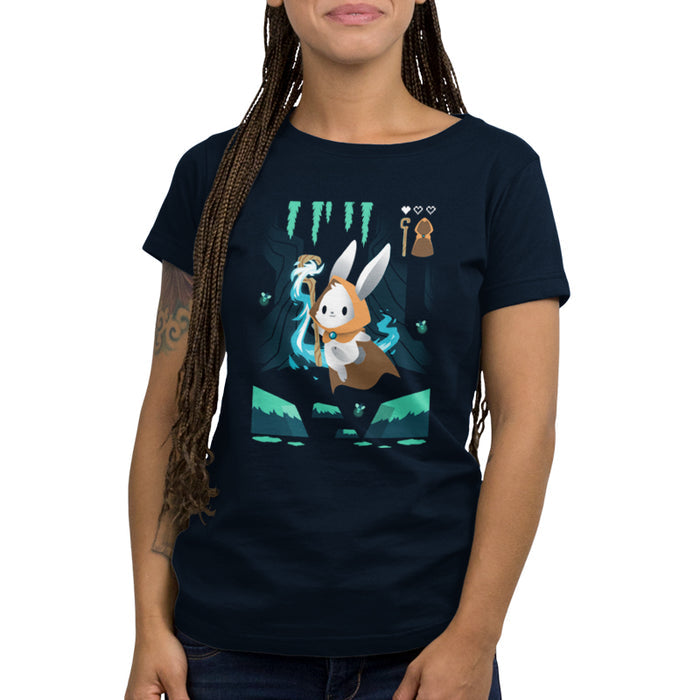 Premium Cotton T-shirt_TeeTurtle Mage Class navy blue apparel featuring an adventurous magical bunny holding a staff and skipping across a river and surrounded by fireflies.