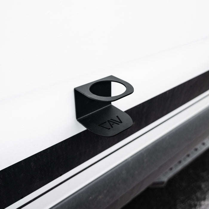 CAV magnetic solo cupholder attached to the side of a van near the door step