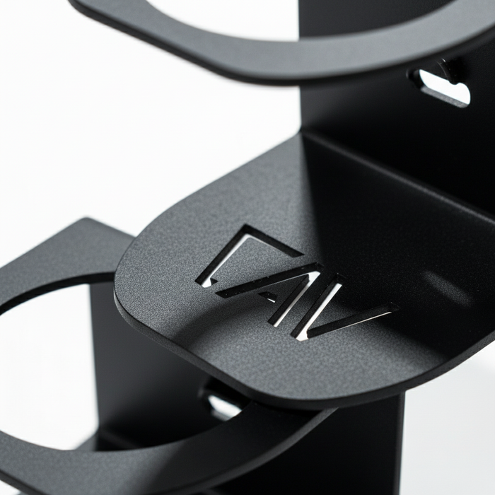 Close-up of black CAV Magnetic Solo Cupholder showing laser-cut CAV logo on metal surface.