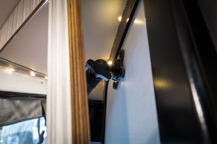 Revel Mount Anywhere 20mm ball with metal mounting plate installed on van interior wall
