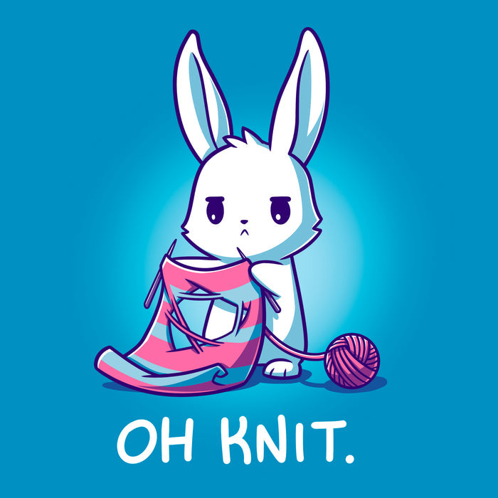Classic Cotton T-shirt_Teeturtle sapphire blue Oh Knit apparel featuring a white rabbit looking distraught. It's holding two knitting needles attached to a blue and pink striped scarf that has a large hole in the middle. There is a ball of pink yarn trailing off to the side and text beneath it that says "Oh knit."
