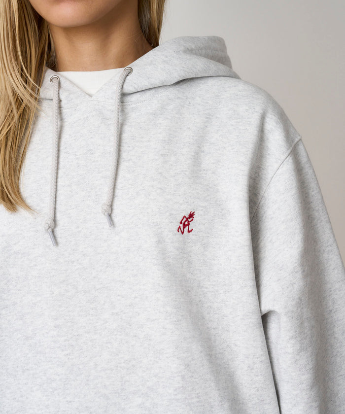Gramicci heather ash colored One Point Hooded Sweatshirt against a light-tone background.