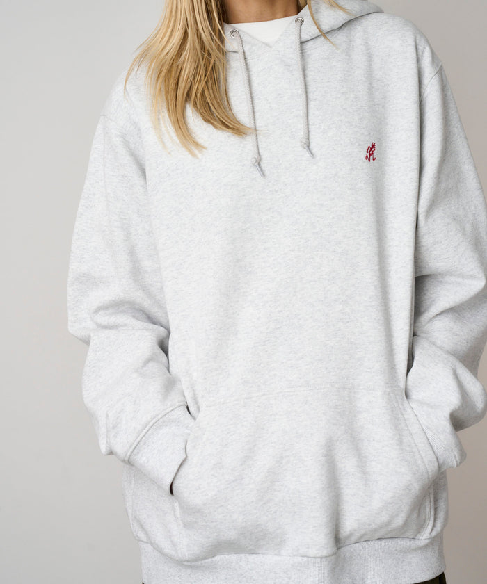 Gramicci heather ash colored One Point Hooded Sweatshirt against a light-tone background.