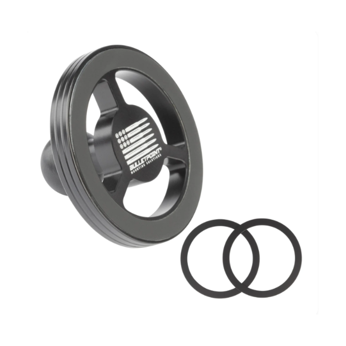 black circular bulletpoint magnetic phone mount with a ribbed outer edge and a cutout center, shown alongside two black O-rings