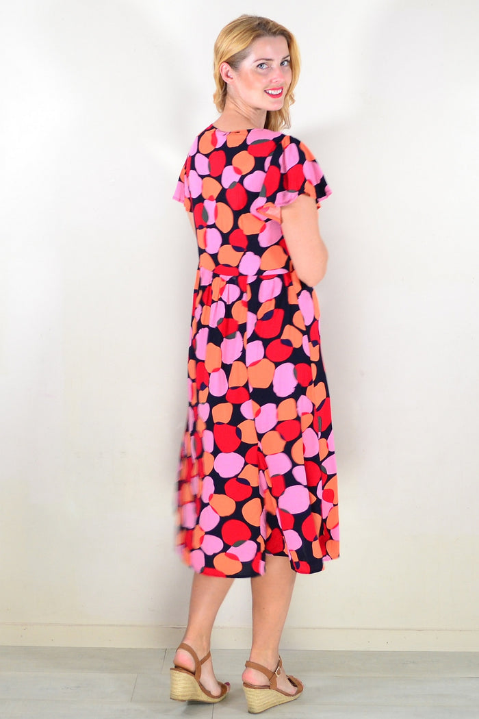 Pink and orange spotted tunic dress by Hourglass featuring a relaxed fit and lightweight fabric.