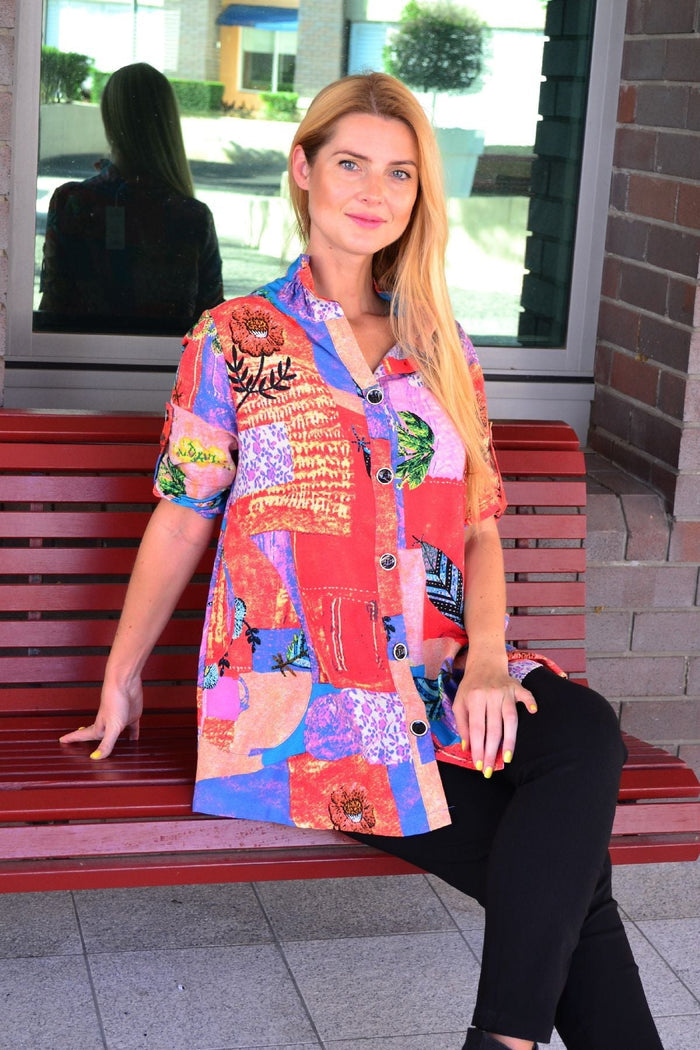 Ruby Rain quilted pocket high collar tunic shirt with a relaxed fit, featuring a front pocket and quilted fabric detail.
