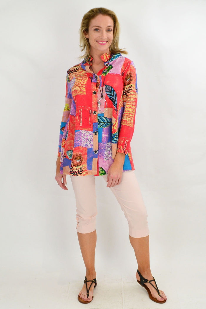 Ruby Rain quilted pocket high collar tunic shirt with long sleeves and button details, in a cozy, textured fabric.