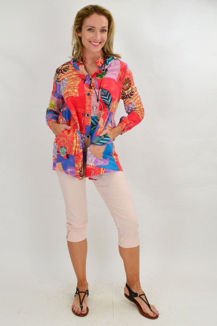Ruby Rain quilted pocket high collar tunic shirt with front pockets and quilted fabric, displayed on a hanger.