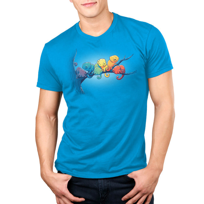 Premium Cotton T-shirt_Teeturtle cobalt blue Rainbow Chameleons apparel featuring a group of six chameleons sitting on a tree branch, each a different color, in rainbow gradient.
