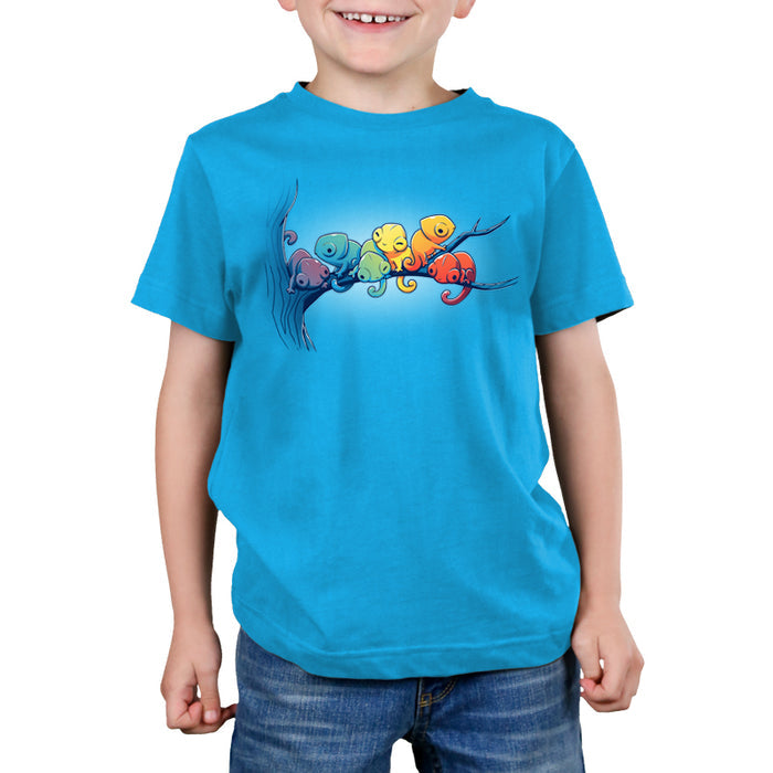 Premium Cotton T-shirt_Teeturtle cobalt blue Rainbow Chameleons apparel featuring a group of six chameleons sitting on a tree branch, each a different color, in rainbow gradient.