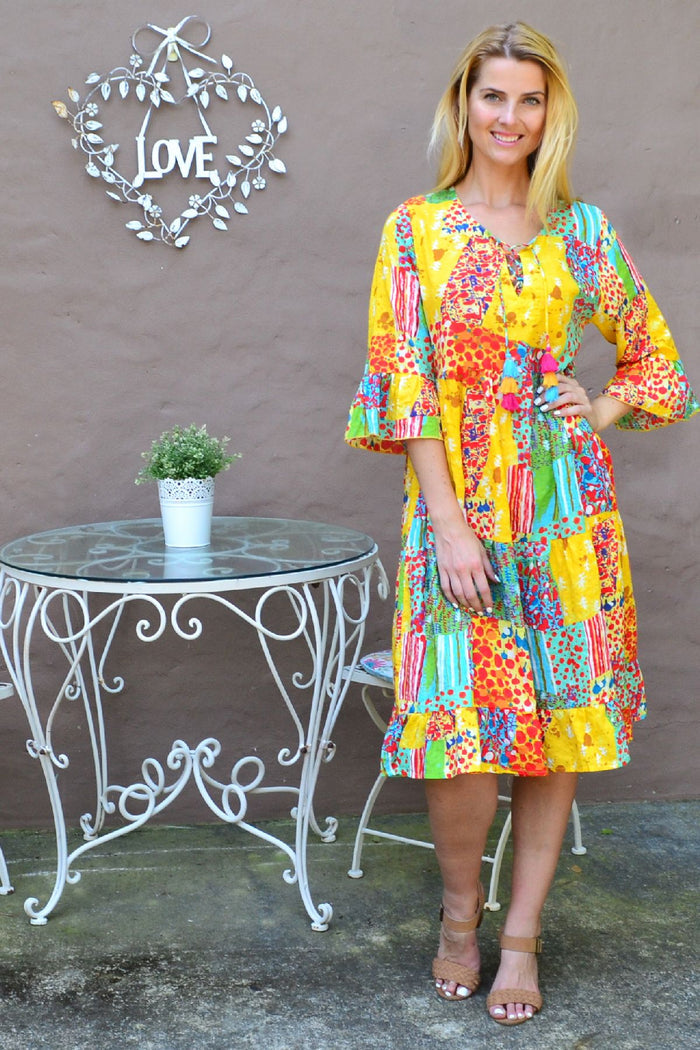 Wishstone Sandy Beach tiered tunic dress with flowing fabric and beach-inspired design, perfect for casual summer wear.