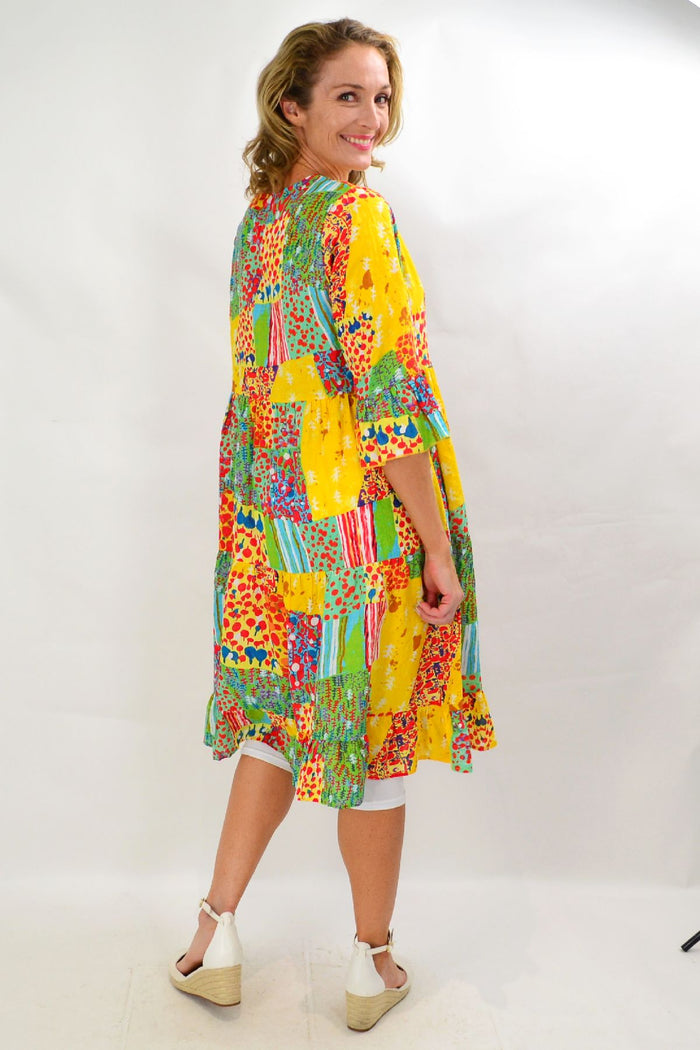 Wishstone Sandy Beach tiered tunic dress displayed on a hanger with a relaxed fit and lightweight fabric, perfect for casual summer wear.