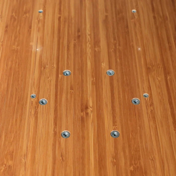 Close-up of a Small Universal Table Top with bamboo finish and visible metal fasteners.