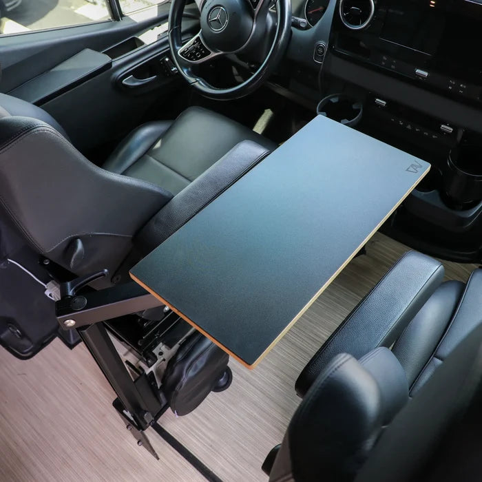Small Universal Table Top mounted between van seats with black finish and swivel arm.