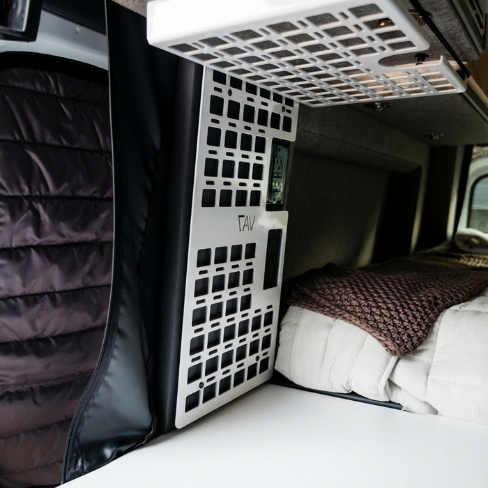 Storyteller Galley MOLLE Panel by TAV mounted in van interior near bed and storage area