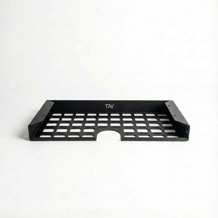 Storyteller undercabinet shelf for driver side, black metal with ventilated design and TAV logo.