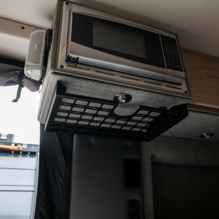 STO Undercabinet Shelf mounted below a microwave in a van interior.