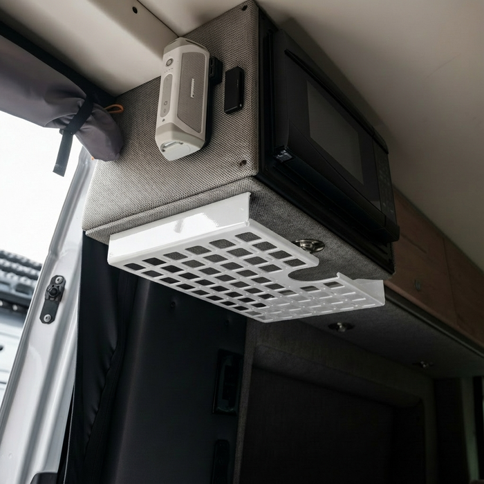 STO Undercabinet Shelf mounted under upper cabinet in a van interior for added storage.