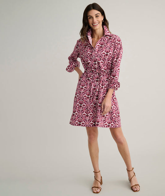 Model is wearing UNTUCKit Taylor dress in pink print.