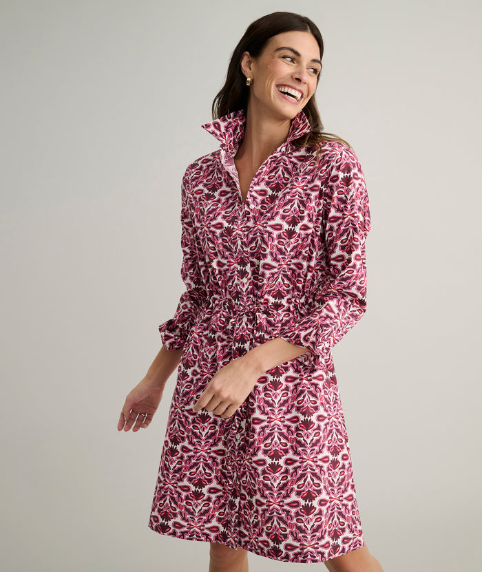 Model is wearing UNTUCKit Taylor dress in pink print.